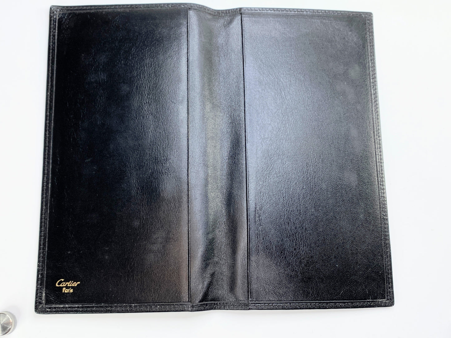 Vintage Must de Cartier, black leather check cover wallet 6 3/4" GS204
