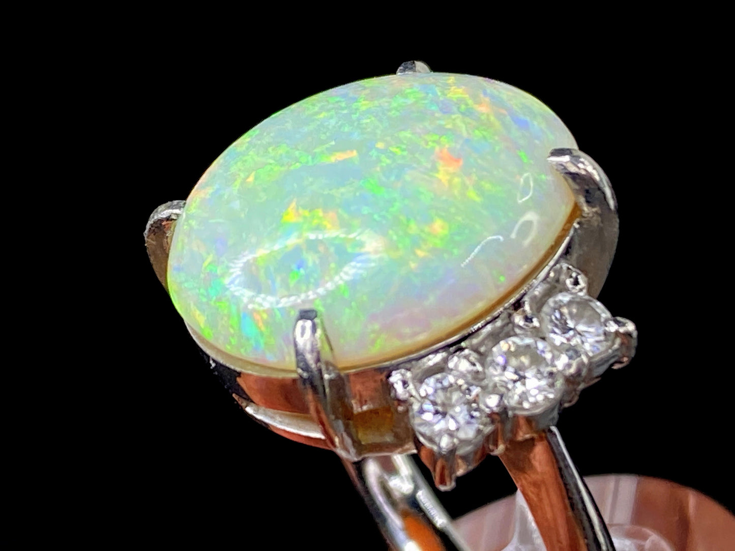 Platinum 7.88ctw oval cut Opal 0.48ctw G/VS2 Round brilliant diamond ring