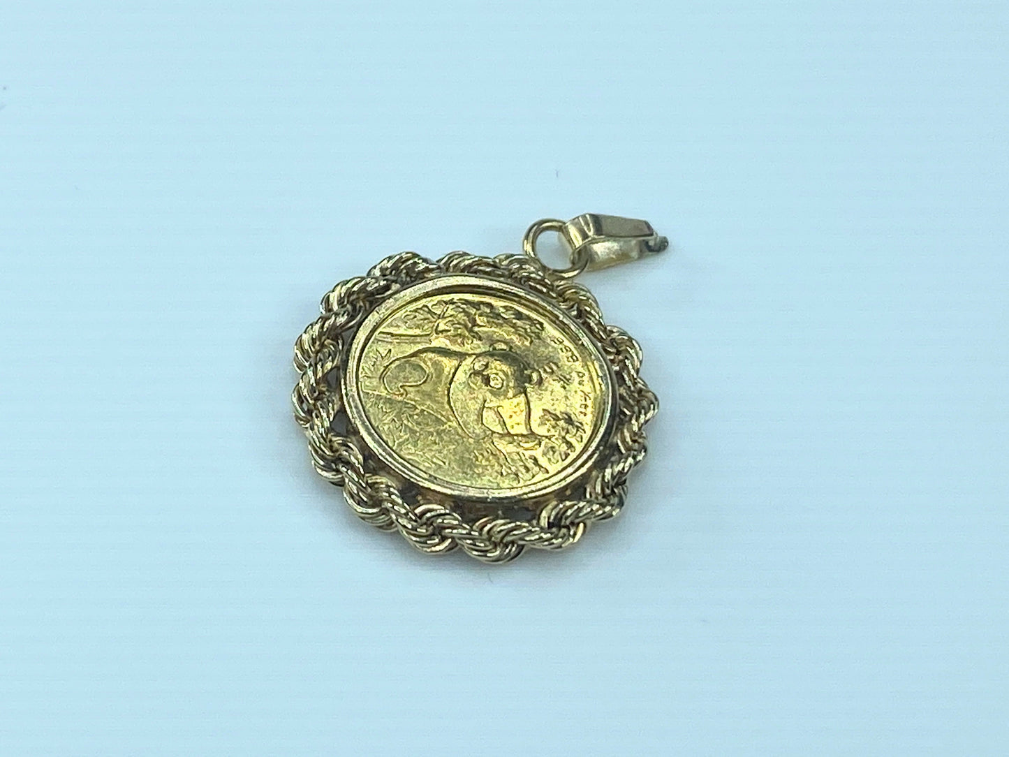 c1980 $5.0 1/20 oz 999.0 Panda coin in 14K Bamboo bezel