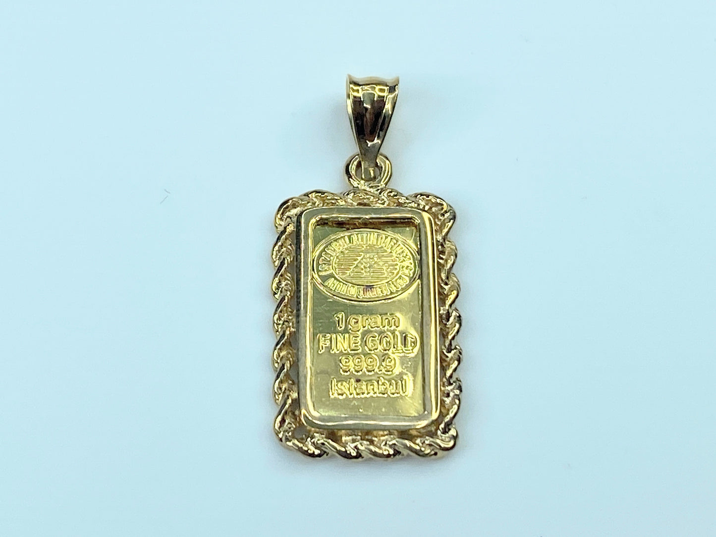 999.9 Istanbul 1.0g bullion in 14K rope bezel