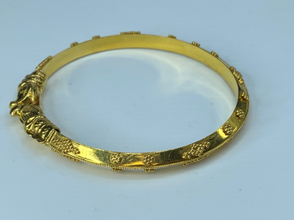 21K yellow gold Dolphin heads knife edge bangle