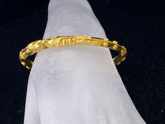 21K yellow gold Dolphin heads knife edge bangle