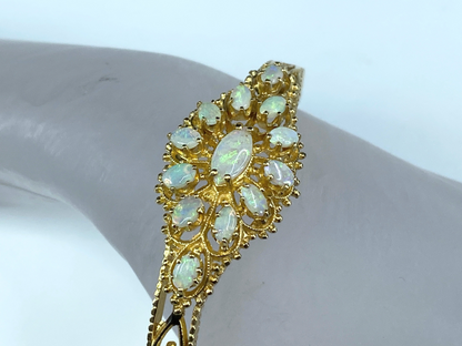 14K gold 4.15ct Oval Opal cabochon decorated bangle 19.2g 6.7"