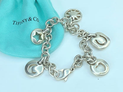 Tiffany & Co Silver Heart Sun Star Moon Horseshoe Stencil Charm bracelet