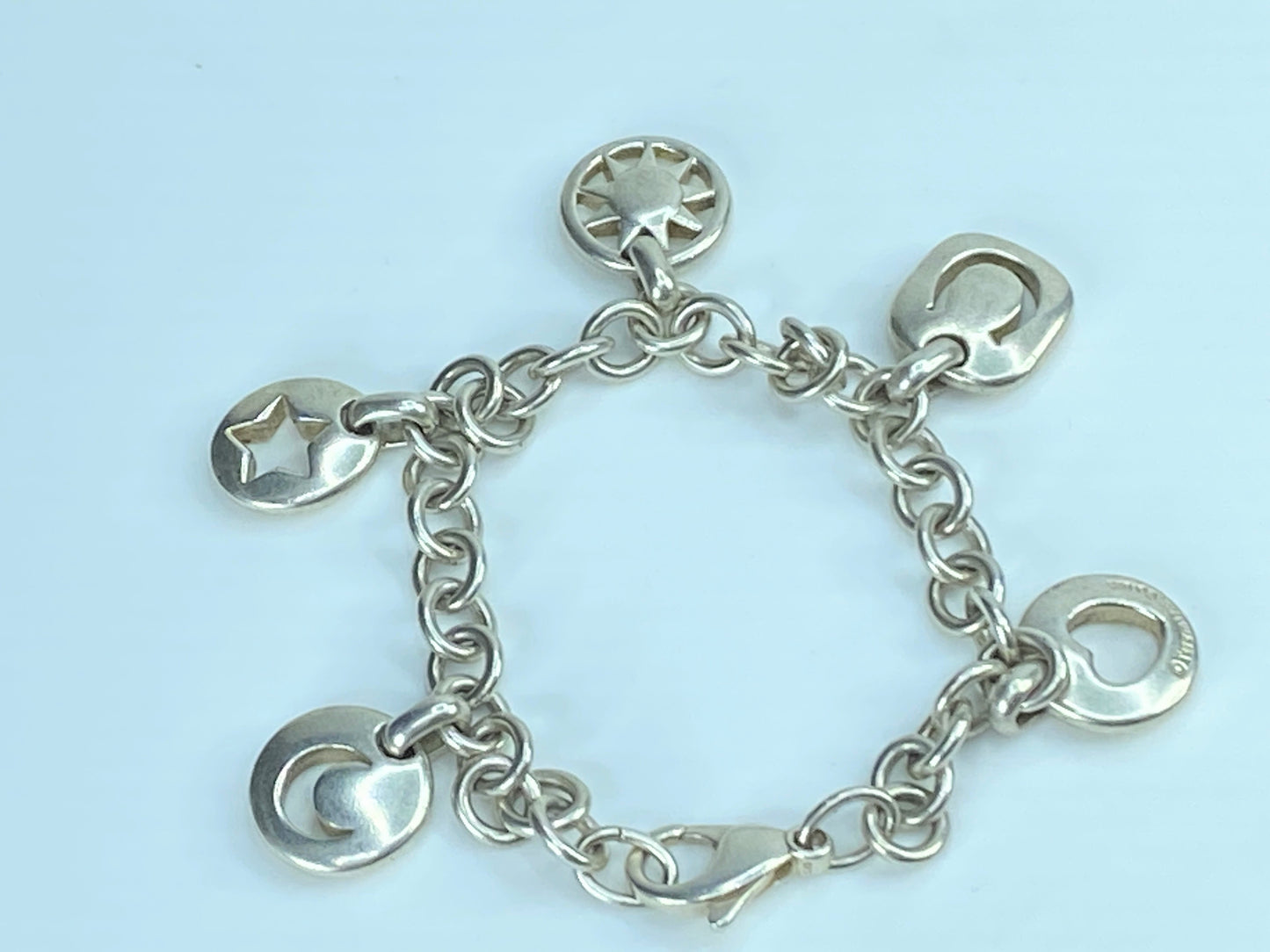 Tiffany & Co Silver Heart Sun Star Moon Horseshoe Stencil Charm bracelet