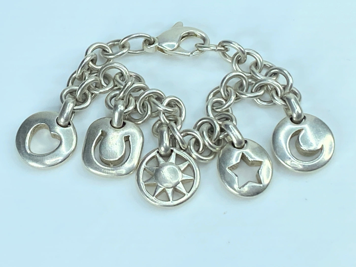 Tiffany & Co Silver Heart Sun Star Moon Horseshoe Stencil Charm bracelet