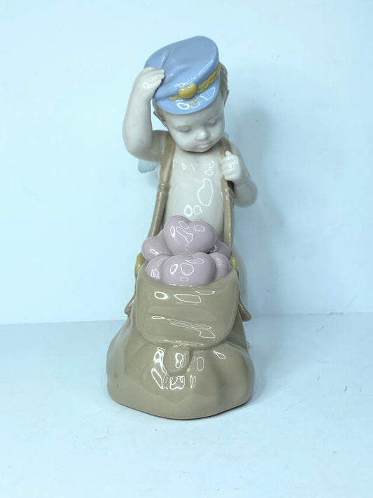 Lladro Love Letters Cupid Figurine In Blue Cap With Sack of Pink Hearts A119