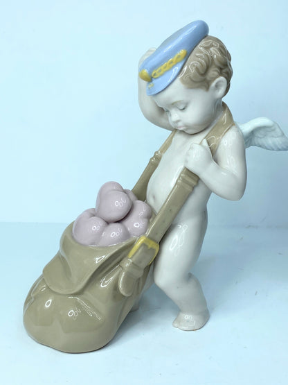 Lladro Love Letters Cupid Figurine In Blue Cap With Sack of Pink Hearts A119