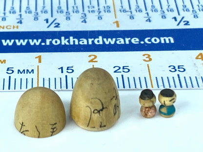 Rare miniature 4.5mm tall pair of Kokeshi in wood egg shell case 14mm A22