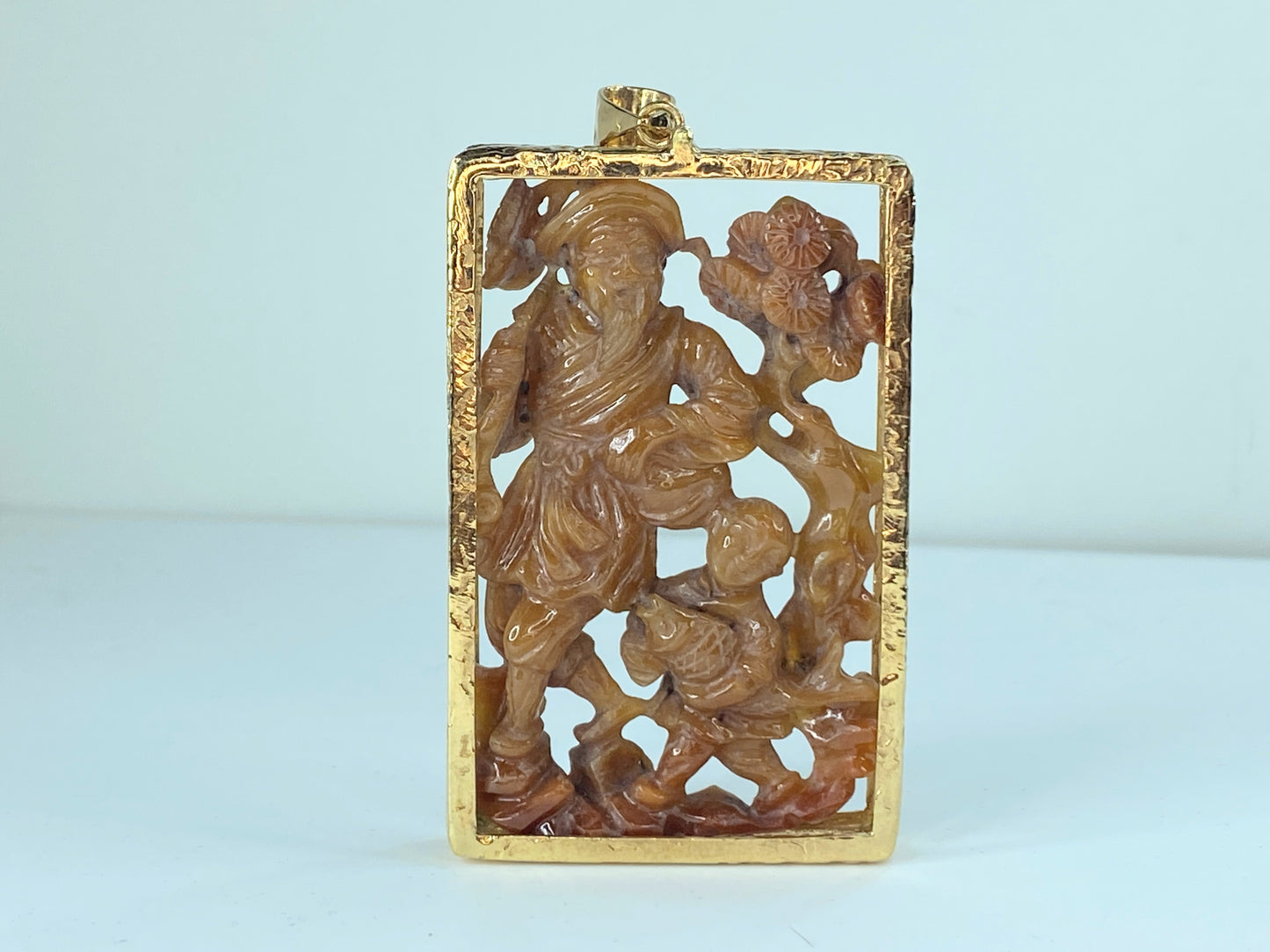 Custom orange jadeite carving wiseman with boy cradling a fish