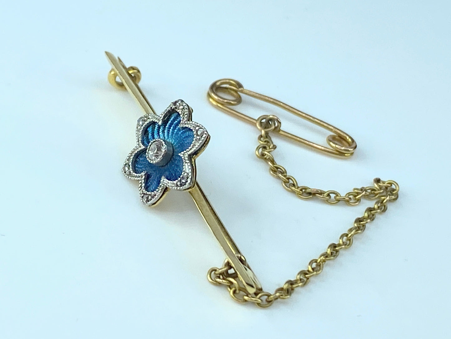 Blue Guilloche blue enamel Floral Diamond bar pin in 18 karat