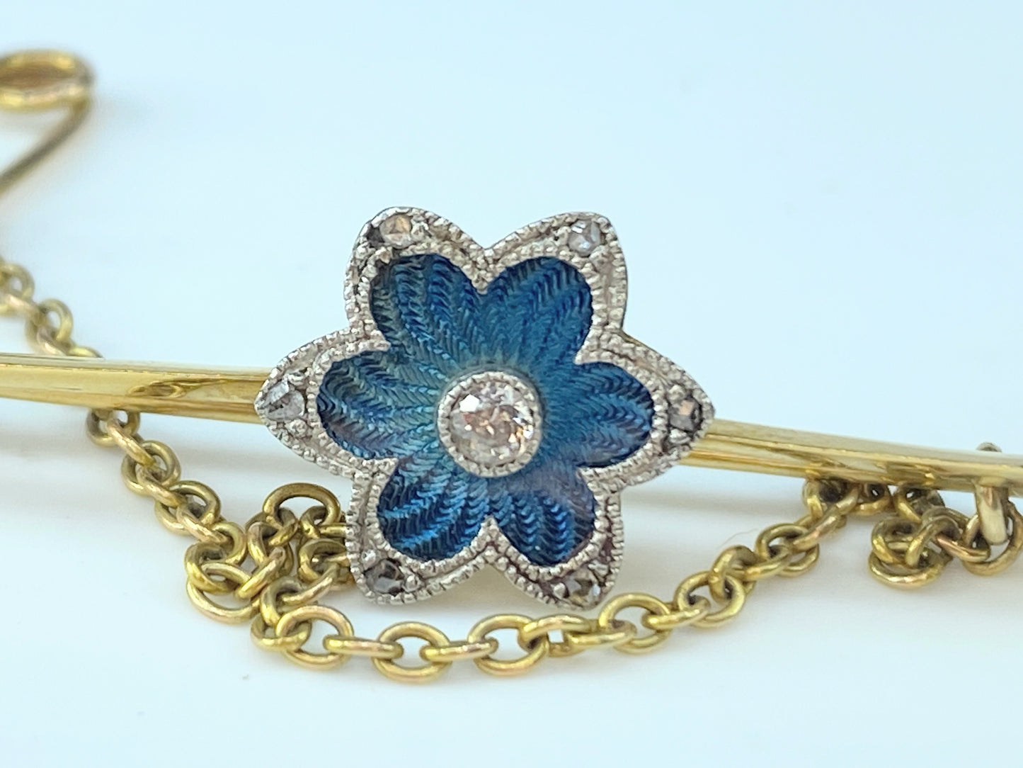 Blue Guilloche blue enamel Floral Diamond bar pin in 18 karat