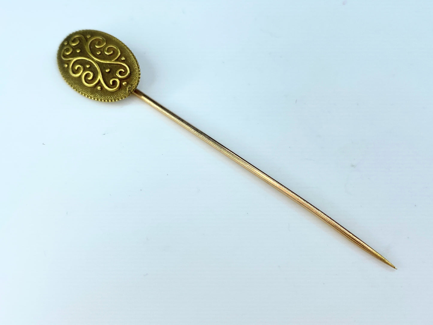 Antique 18 Karat gold stick pin by Day, Clark & Co.