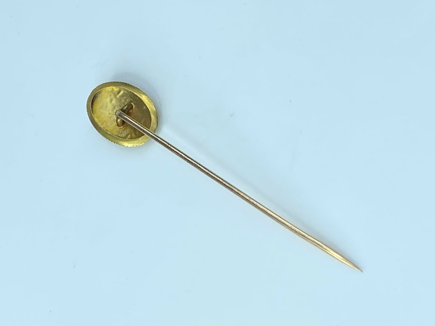 Antique 18 Karat gold stick pin by Day, Clark & Co.