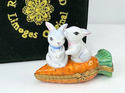 Rochard Limoges Loving Bunny rabbit atop a Carrot Trinket in original box A520