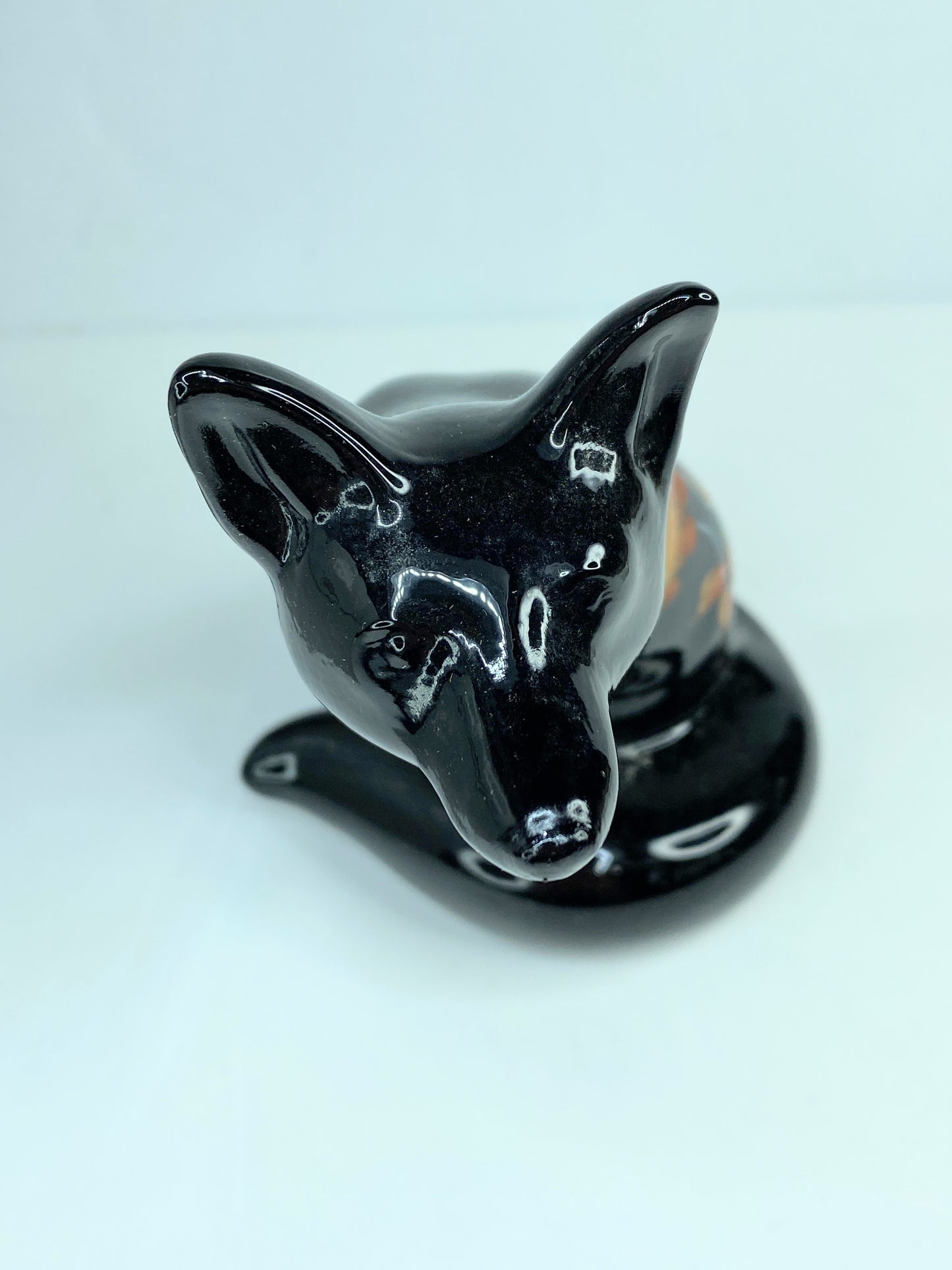 Fenton Art Glass hand-painted black fox figurine in autumn leaves design A587