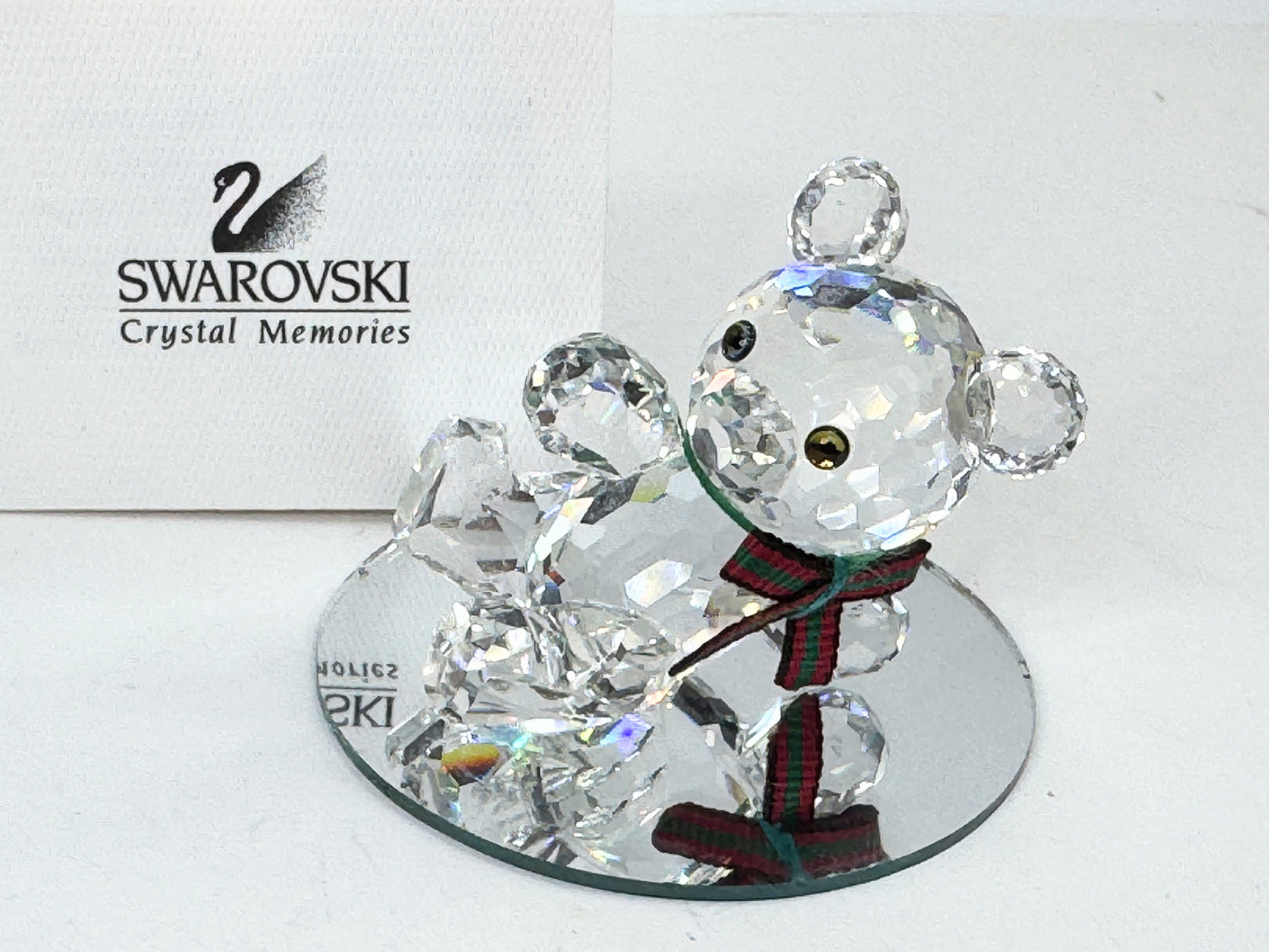 Swarovski Crystal reclining Kris Bear with a red & green scarf S220