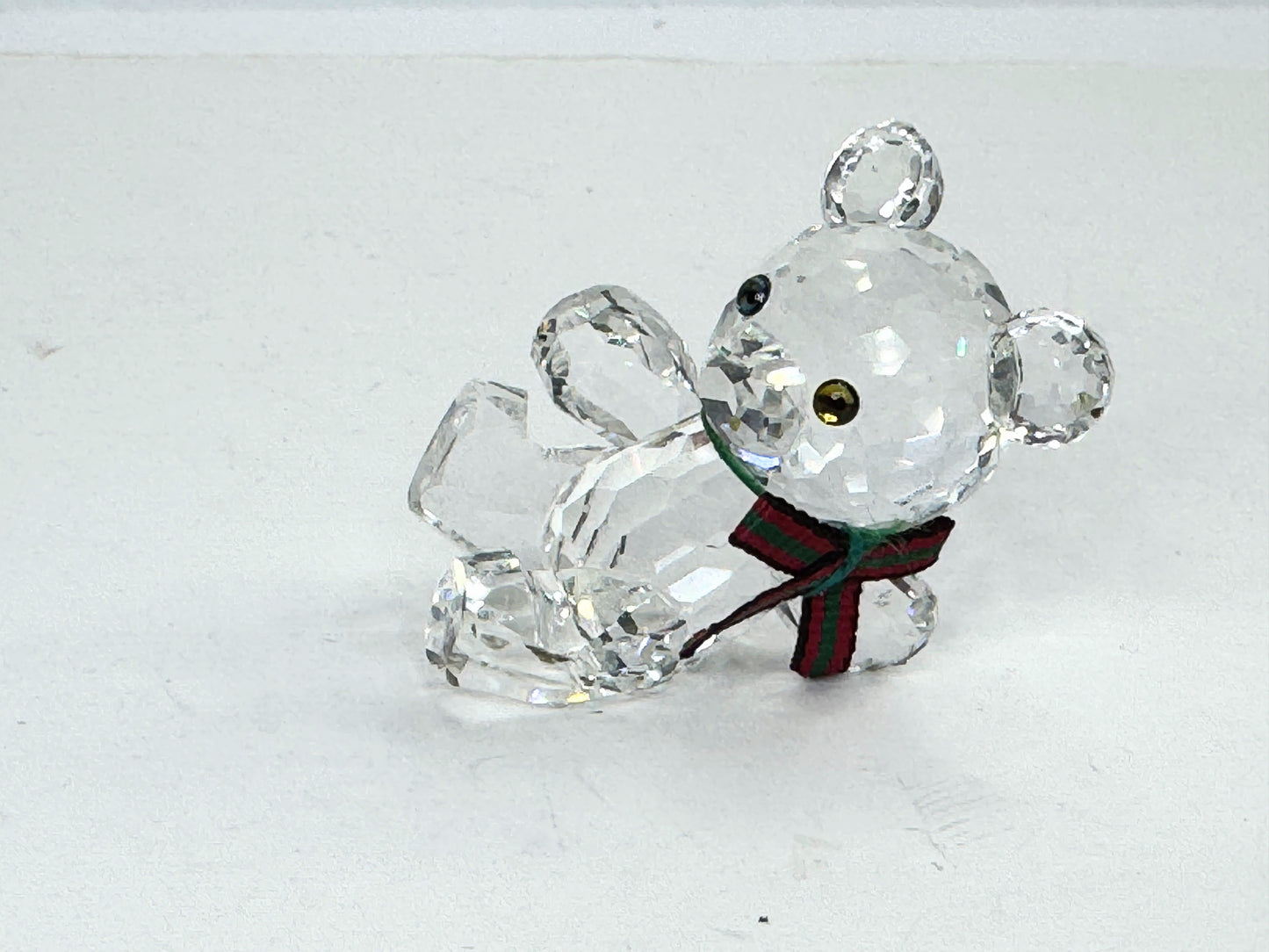 Swarovski Crystal reclining Kris Bear with a red & green scarf S220