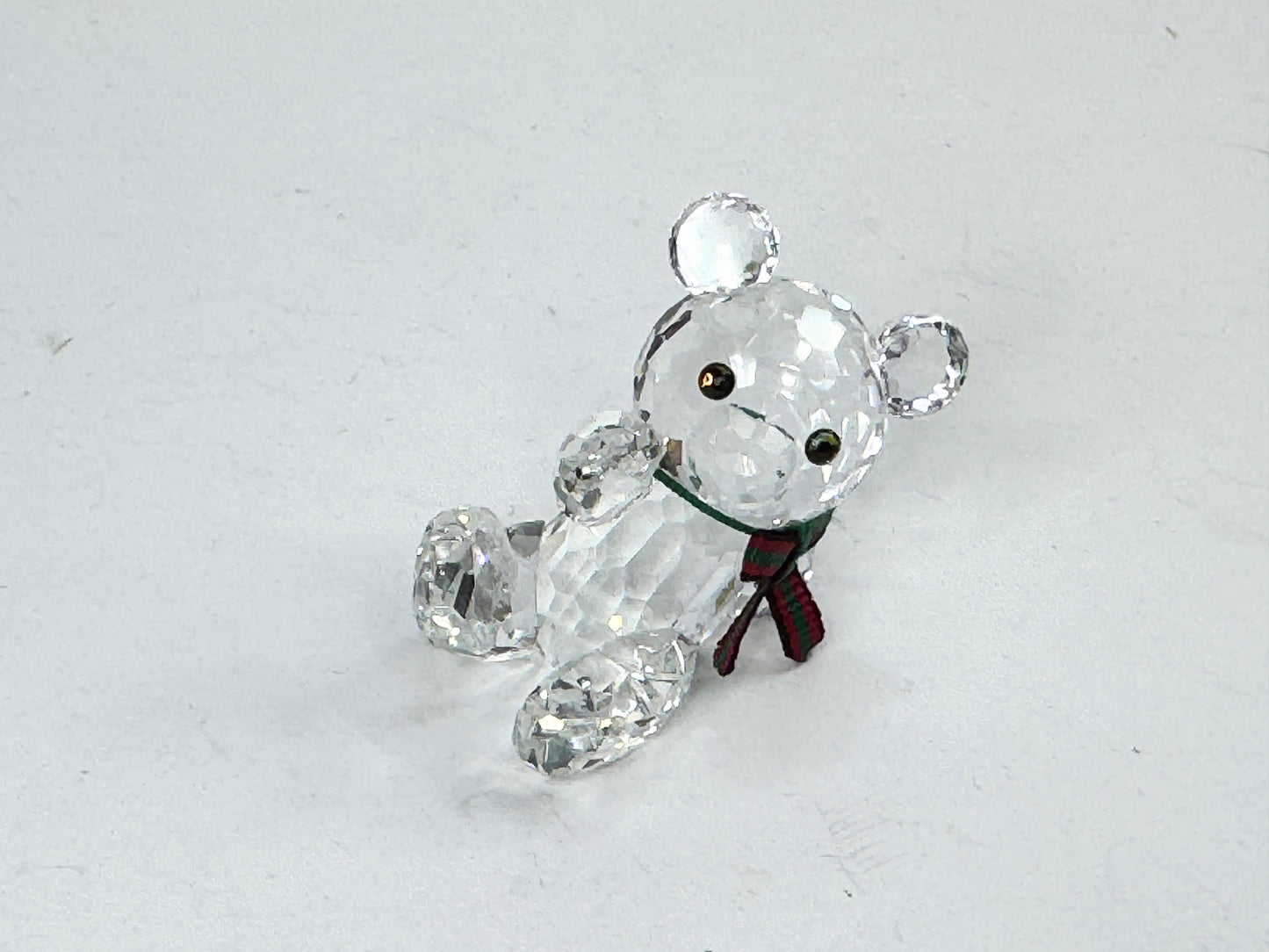 Swarovski Crystal reclining Kris Bear with a red & green scarf S220