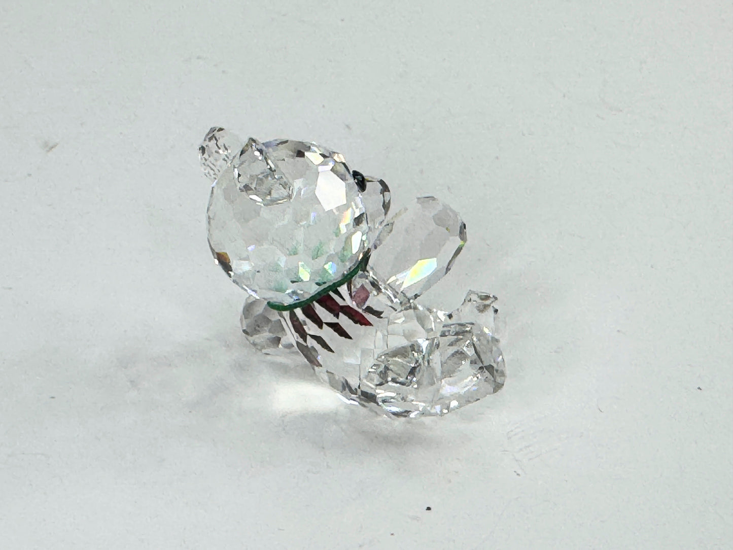Swarovski Crystal reclining Kris Bear with a red & green scarf S220