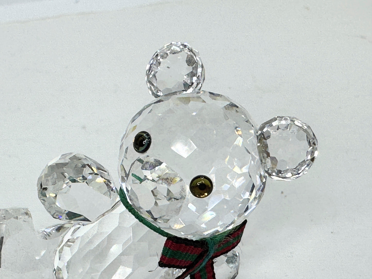 Swarovski Crystal reclining Kris Bear with a red & green scarf S220