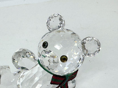 Swarovski Crystal reclining Kris Bear with a red & green scarf S220