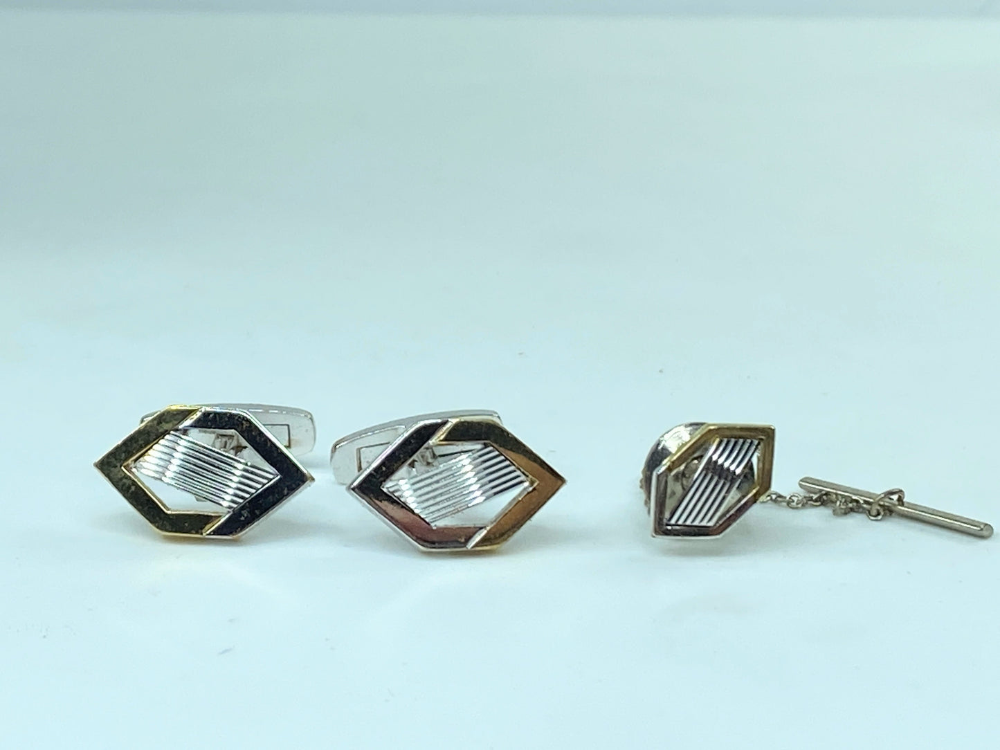Yves Saint Laurent gold and silver tie pin and cufflinks set in box GS449