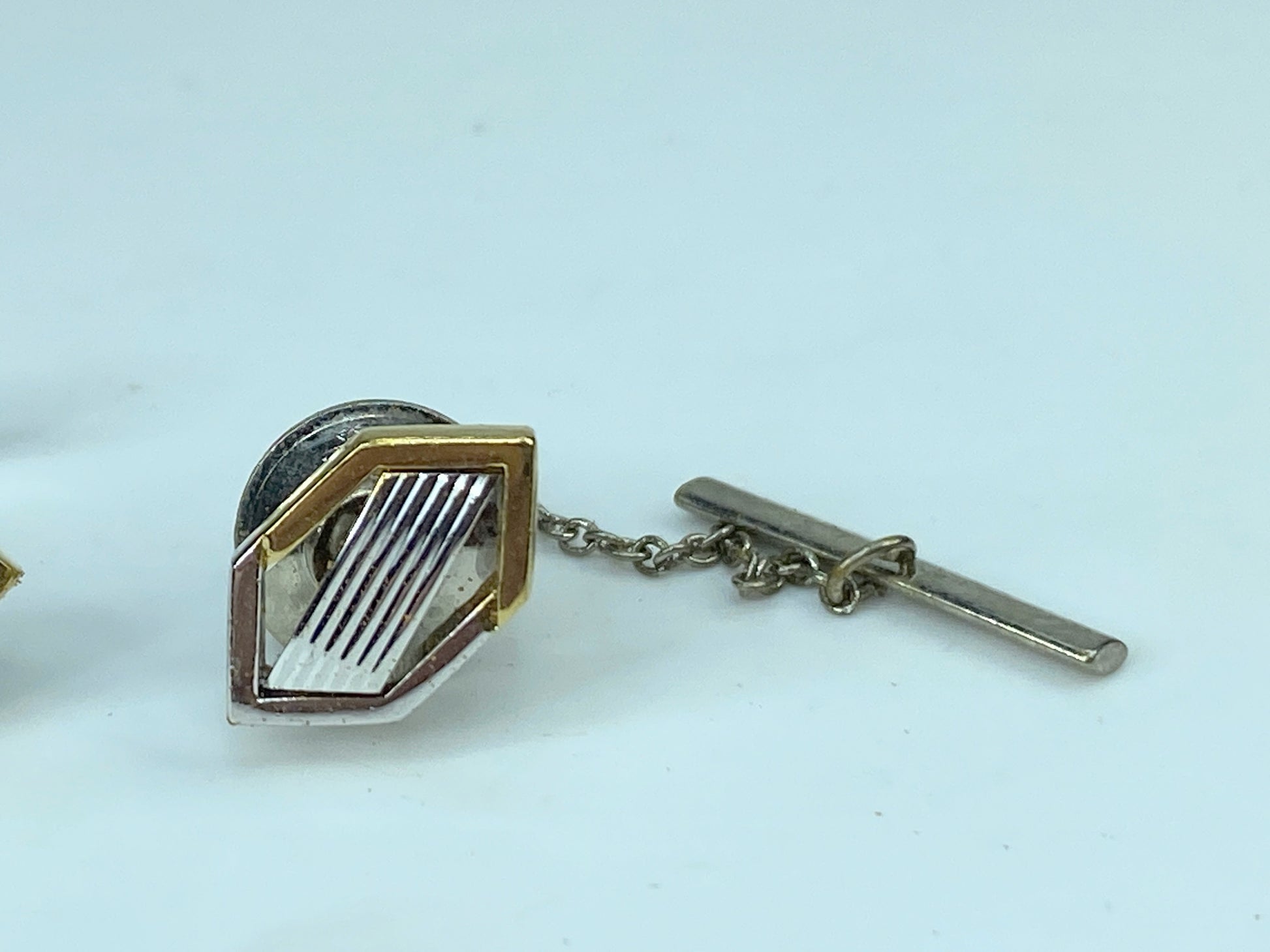 Yves Saint Laurent gold and silver tie pin and cufflinks set in box GS449
