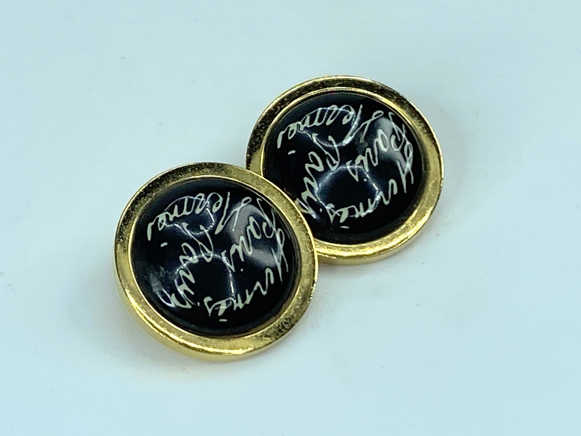 Hermes Gold tone "scribble-scrabble" black round clip on earrings wGS464
