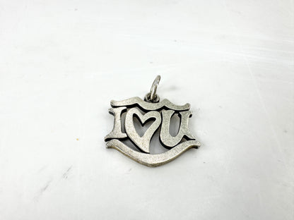 JR1923 - James Avery sterling silver “I Love You” charm pendant with open heart center design. Marked AVERY 925; approx. 19 x 17mm; 2.1g.