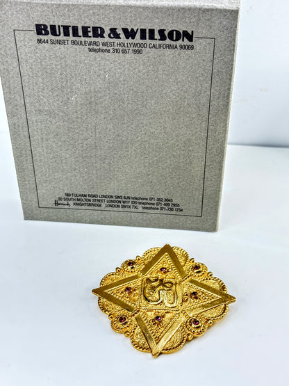 Vintage 1992 Butler & Wilson Gold Tone Hindu Om Brooch Purple Crystals GS852