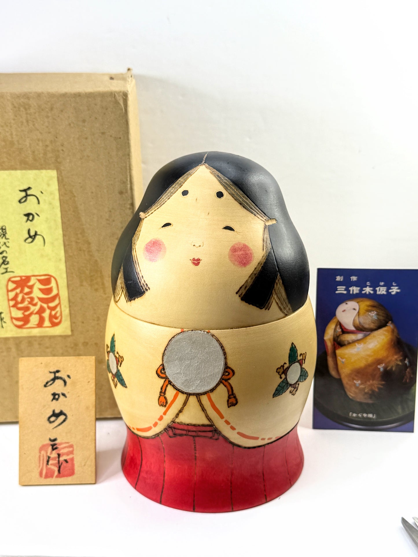 Sansaku Sekiguchi 関口三作 Title: Okame おかめ / 阿亀 Sosaku Kokeshi with Doll Box A1208