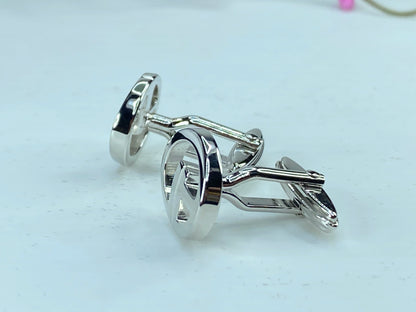 DUNHILL silver tone Logo D cufflinks set in black velvet box GS346