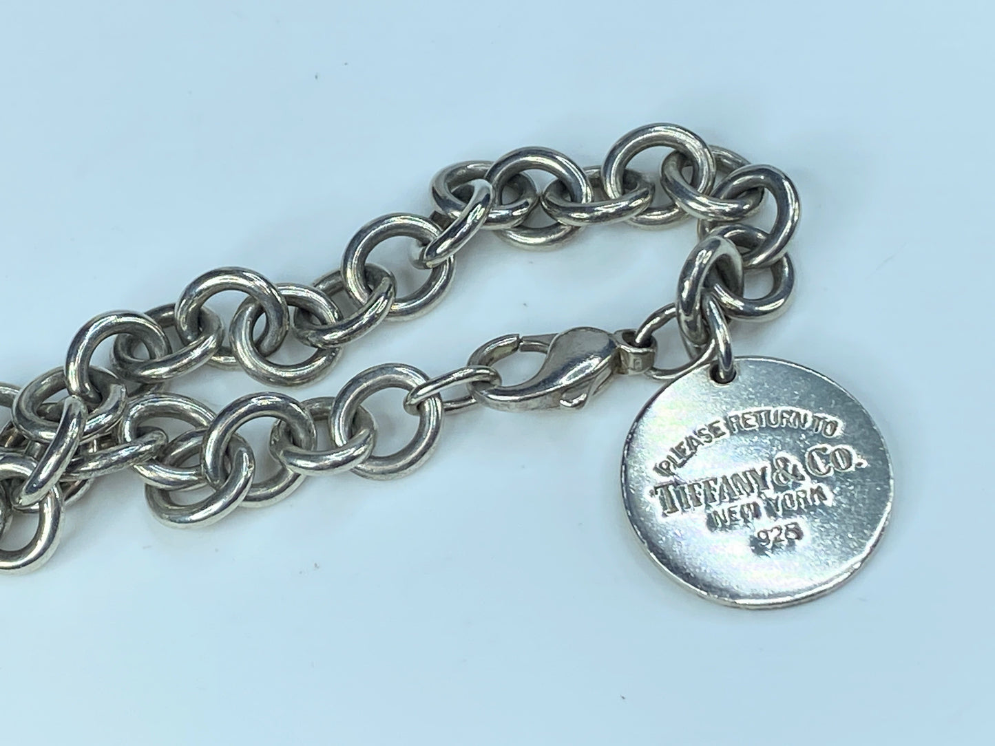 Tiffany & Co “Please Return To Tiffany & Co ” Sterling Round Charm Bracelet